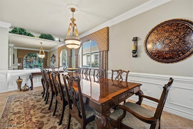 14266 Reflection Lakes Dr, Fort Myers, FL 33907 - dining space featuring ornamental molding, a decorative wall, wainscoting, and tile patterned flooring