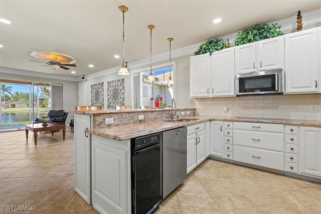 14266 Reflection Lakes Dr, Fort Myers, FL 33907 - kitchen with stainless steel appliances, ornamental molding, backsplash, a peninsula, and white cabinets