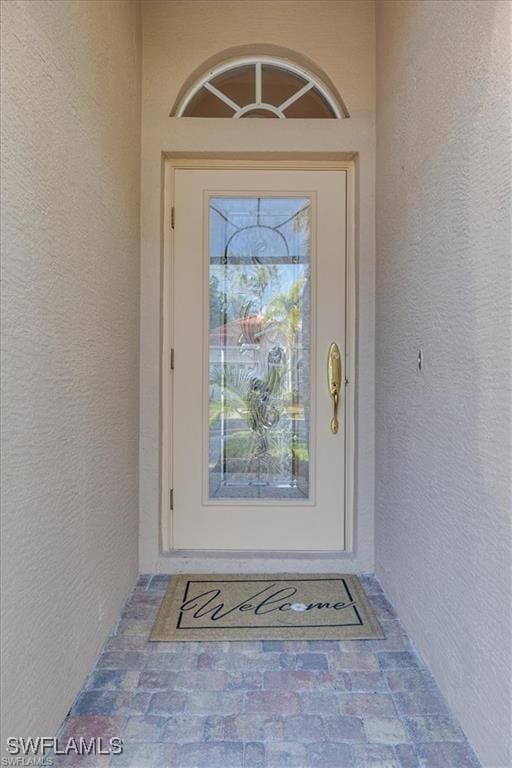 14266 Reflection Lakes Dr, Fort Myers, FL 33907 - entrance to property featuring stucco siding