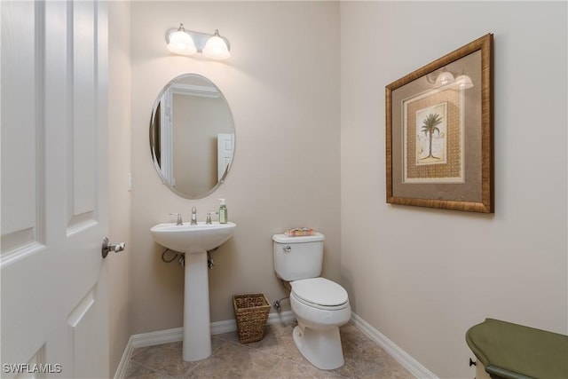 9051 Capistrano St N Unit 4302, Naples, FL 34113 - bathroom featuring toilet and tile patterned flooring