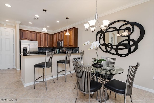9051 Capistrano St N Unit 4302, Naples, FL 34113 - dining space featuring recessed lighting, crown molding, light tile patterned floors, and a chandelier