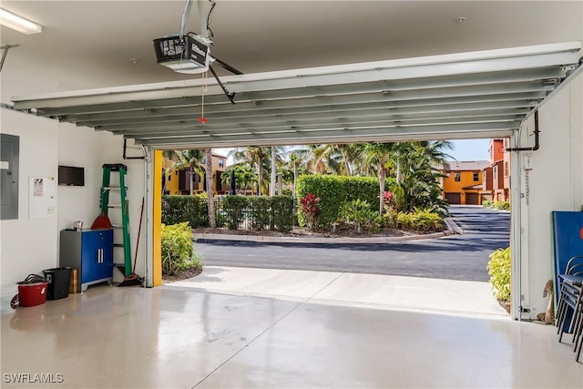 9051 Capistrano St N Unit 4302, Naples, FL 34113 - garage with electric panel and a garage door opener