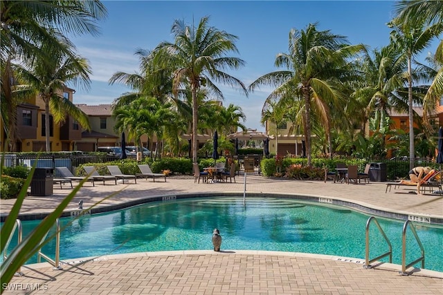 9051 Capistrano St N Unit 4302, Naples, FL 34113 - community pool with a patio