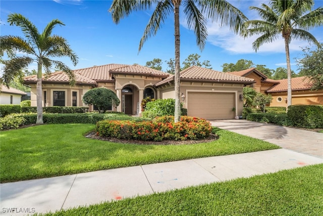 7327 Acorn Way, Naples, FL 34119 - mediterranean / spanish home featuring stucco siding, an attached garage, a front lawn, driveway, and a tile roof