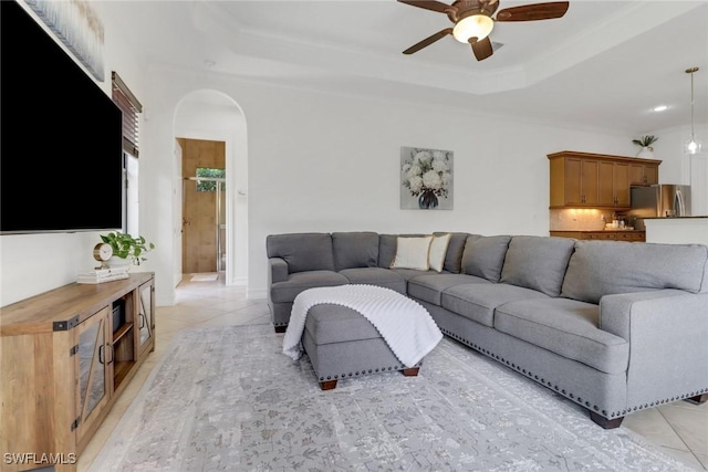 7327 Acorn Way, Naples, FL 34119 - living area featuring a ceiling fan, arched walkways, a raised ceiling, light tile patterned floors, and recessed lighting