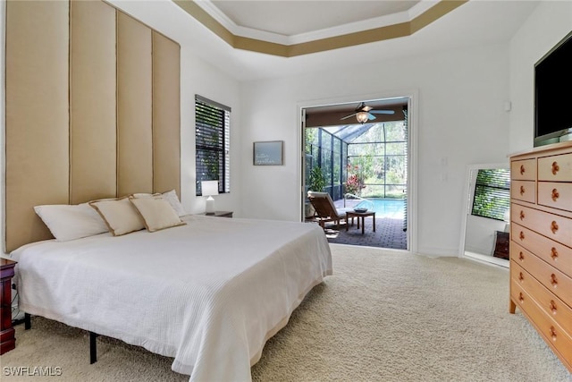 7327 Acorn Way, Naples, FL 34119 - bedroom with access to outside, a sunroom, a raised ceiling, ornamental molding, and light carpet