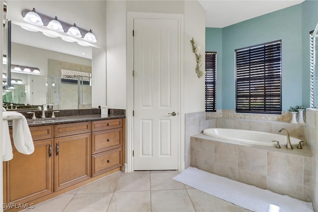 7327 Acorn Way, Naples, FL 34119 - full bathroom featuring tile patterned flooring, vanity, a garden tub, and a stall shower