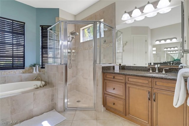 7327 Acorn Way, Naples, FL 34119 - bathroom featuring a garden tub, tile patterned flooring, vanity, and a stall shower