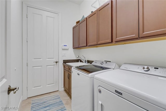 7327 Acorn Way, Naples, FL 34119 - laundry area featuring independent washer and dryer, cabinet space, and light tile patterned floors