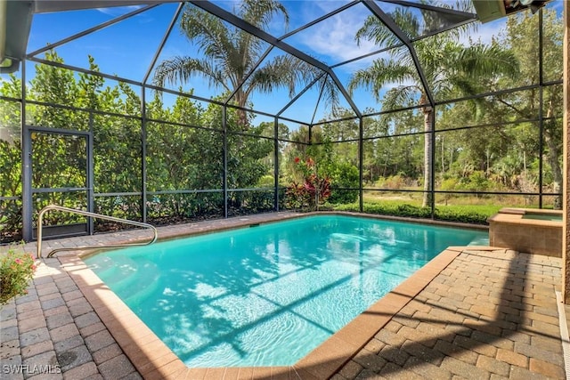 7327 Acorn Way, Naples, FL 34119 - view of pool featuring a lanai, a patio, and a pool with connected hot tub