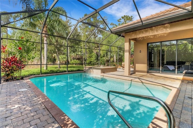 7327 Acorn Way, Naples, FL 34119 - view of pool featuring a patio, glass enclosure, and a pool with connected hot tub