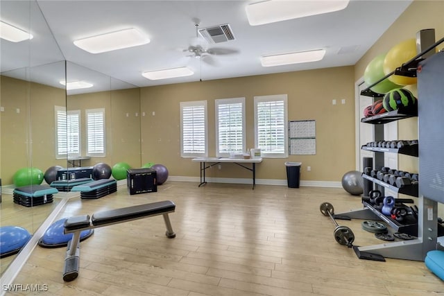 7327 Acorn Way, Naples, FL 34119 - workout room featuring wood finished floors, baseboards, and a ceiling fan
