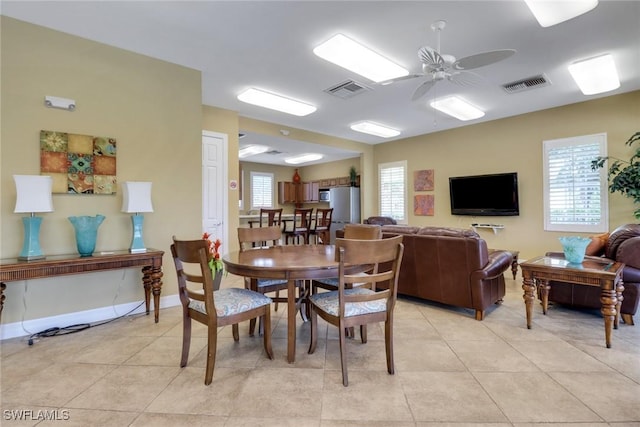 7327 Acorn Way, Naples, FL 34119 - dining space with ceiling fan, light tile patterned floors, and baseboards