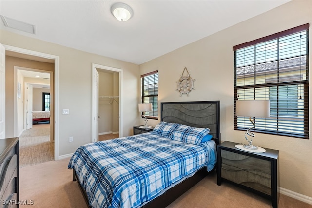 9063 Capistrano St N Unit 4401, Naples, FL 34113 - carpeted bedroom with multiple windows, a spacious closet, and a closet