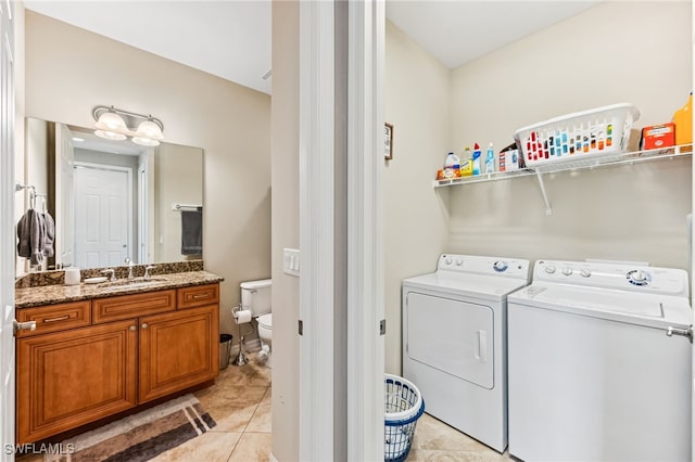 9063 Capistrano St N Unit 4401, Naples, FL 34113 - laundry room featuring washer and dryer and light tile patterned flooring
