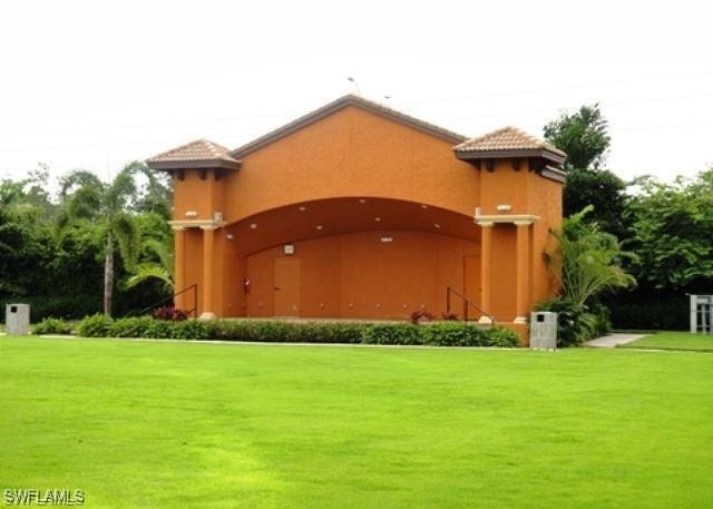 9063 Capistrano St N Unit 4401, Naples, FL 34113 - community / neighborhood sign with a yard