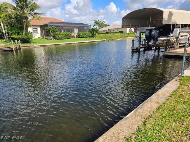 3616 SW 1st Pl, Cape Coral, FL 33914 - dock area featuring a water view and boat lift