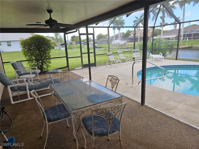 3616 SW 1st Pl, Cape Coral, FL 33914 - sunroom / solarium with a ceiling fan, a residential view, and a water view