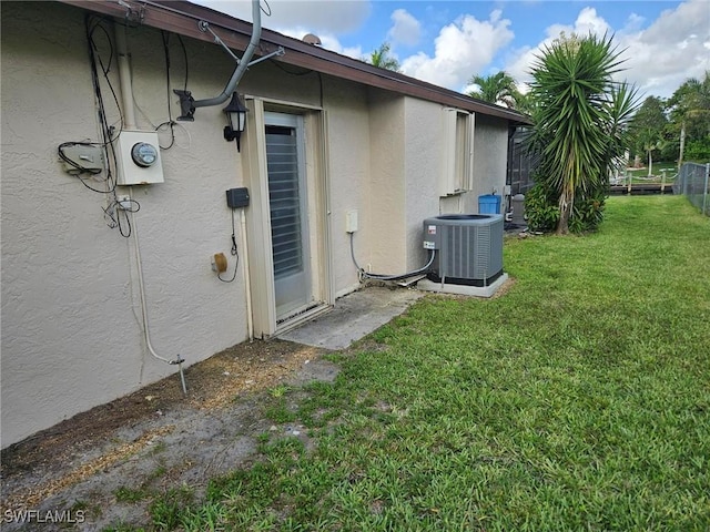 3616 SW 1st Pl, Cape Coral, FL 33914 - view of side of home with stucco siding and a yard