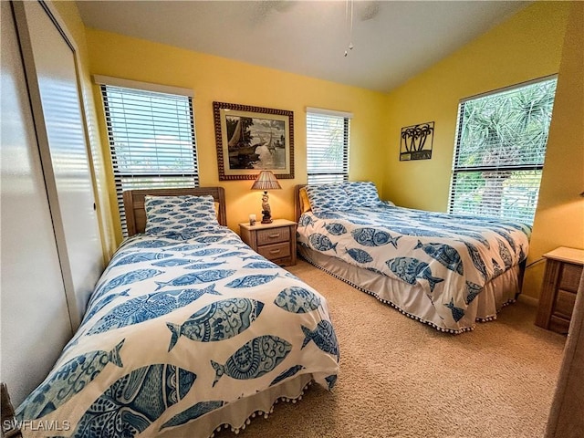 16750 Bocilla Palms Dr Unit 74, Bokeelia, FL 33922 - carpeted bedroom featuring vaulted ceiling