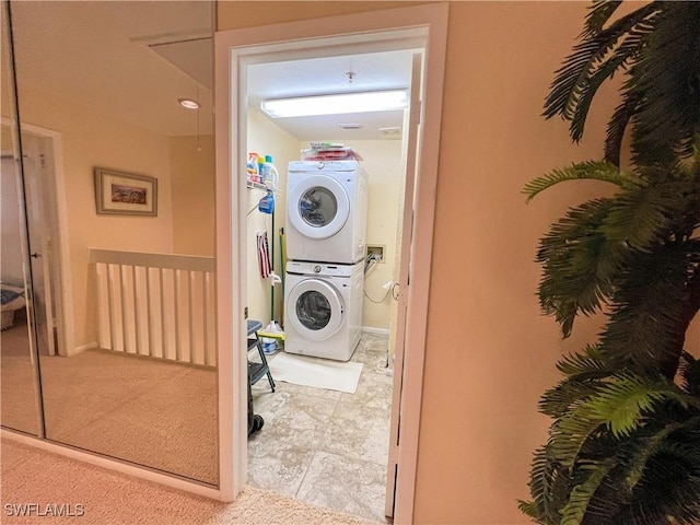 16750 Bocilla Palms Dr Unit 74, Bokeelia, FL 33922 - laundry area with stacked washing machine and dryer and light colored carpet