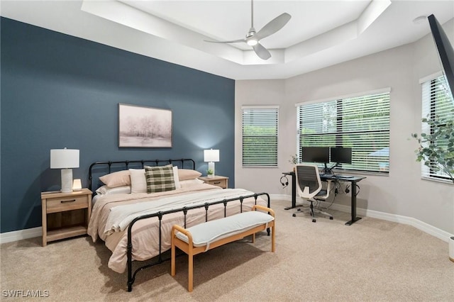 4119 Zelkova Ct, Naples, FL 34119 - bedroom with light carpet, a raised ceiling, ceiling fan, and a desk