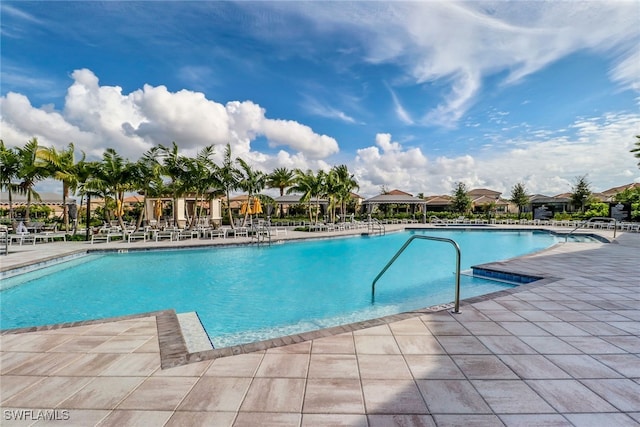 4119 Zelkova Ct, Naples, FL 34119 - community pool featuring a patio