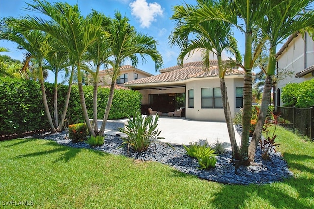 4119 Zelkova Ct, Naples, FL 34119 - rear view of property featuring stucco siding, a ceiling fan, a patio area, and a tiled roof