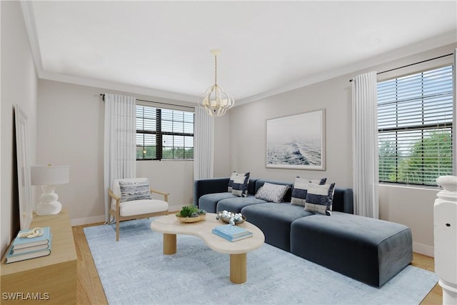 4119 Zelkova Ct, Naples, FL 34119 - living area featuring a chandelier, wood finished floors, and ornamental molding