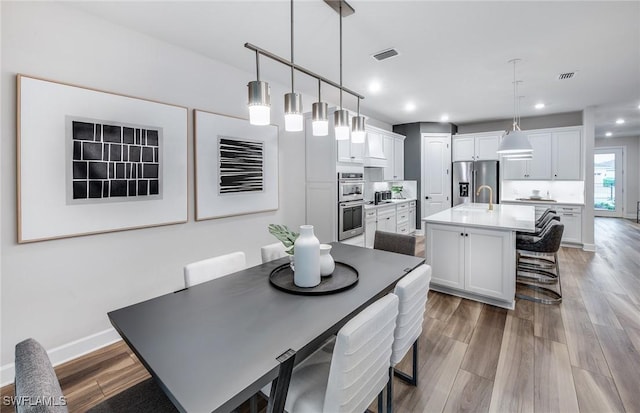 3706 Wild Sage Way, Alva, FL 33920 - dining space featuring wood finished floors, recessed lighting, and baseboards