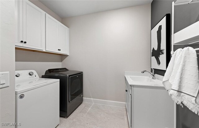 3706 Wild Sage Way, Alva, FL 33920 - laundry area featuring washer and dryer, cabinet space, and baseboards