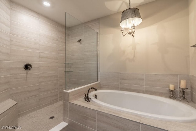 16375 Viansa Way Unit 102, Naples, FL 34110 - bathroom with a bath and a walk in shower