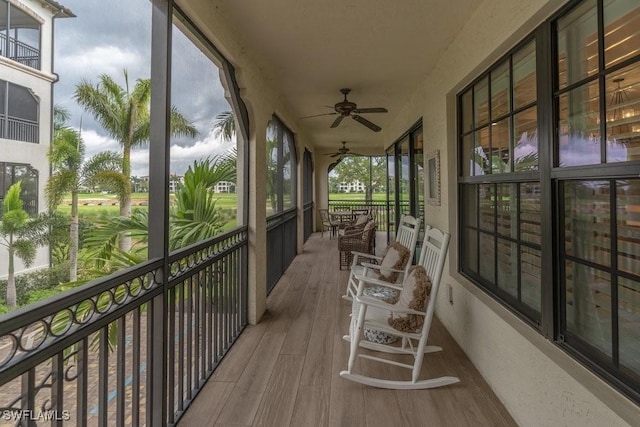16375 Viansa Way Unit 102, Naples, FL 34110 - unfurnished sunroom featuring a ceiling fan
