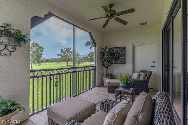 16375 Viansa Way Unit 102, Naples, FL 34110 - sunroom / solarium with ceiling fan, view of golf course, and outdoor lounge area
