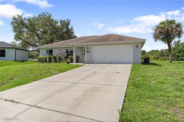 1429 Jabara Cir, Labelle, FL 33935 - single story home with an attached garage, stucco siding, concrete driveway, and a front yard