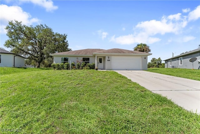 1429 Jabara Cir, Labelle, FL 33935 - single story home with driveway, an attached garage, stucco siding, and a front yard