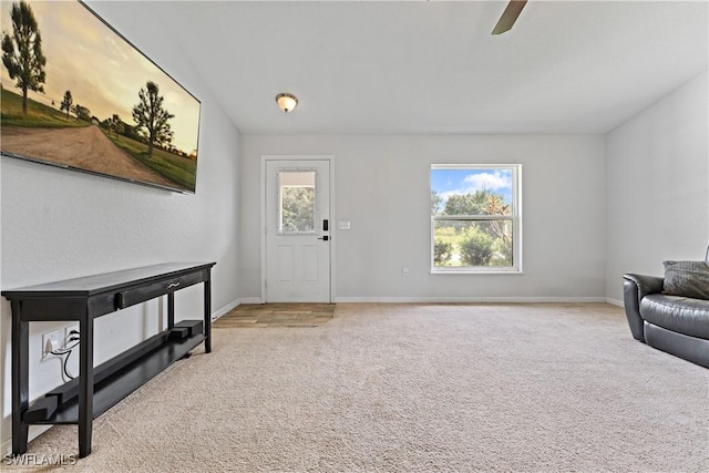 1429 Jabara Cir, Labelle, FL 33935 - entrance foyer featuring light colored carpet and a ceiling fan