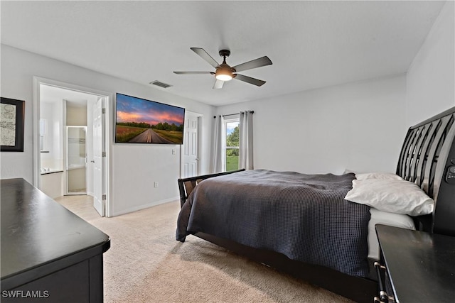 1429 Jabara Cir, Labelle, FL 33935 - bedroom with light colored carpet, a ceiling fan, and ensuite bath
