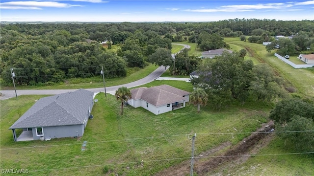 1429 Jabara Cir, Labelle, FL 33935 - aerial view of property and surrounding area with a heavily wooded area