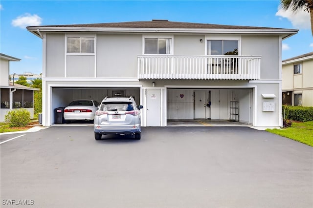3291 Royal Canadian Trce Unit 3, Fort Myers, FL 33907 - view of front of house with a garage and asphalt driveway