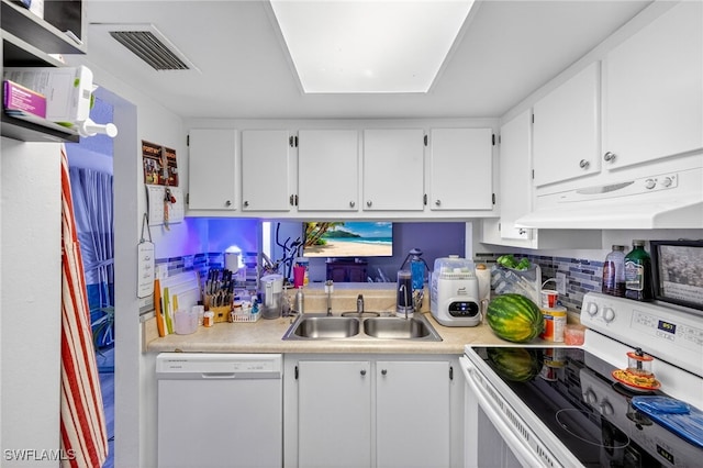 3291 Royal Canadian Trce Unit 3, Fort Myers, FL 33907 - kitchen with white appliances, under cabinet range hood, light countertops, white cabinets, and tasteful backsplash