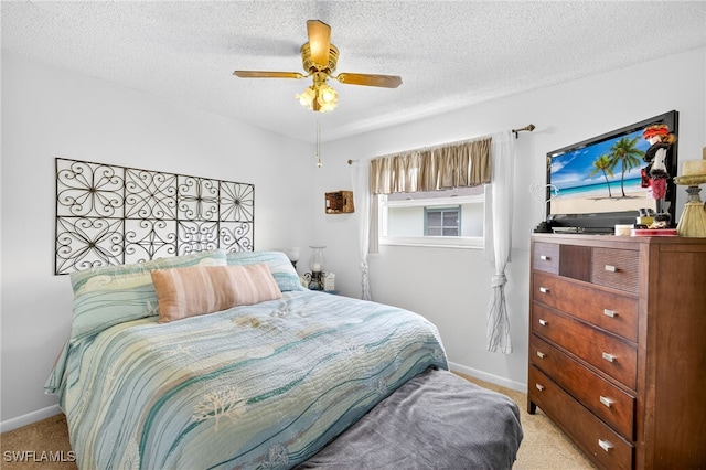 3291 Royal Canadian Trce Unit 3, Fort Myers, FL 33907 - bedroom featuring light colored carpet, a textured ceiling, and a ceiling fan