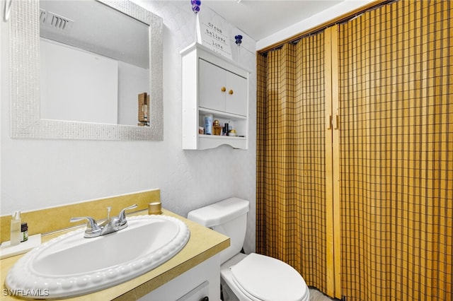 3291 Royal Canadian Trce Unit 3, Fort Myers, FL 33907 - bathroom featuring toilet and vanity