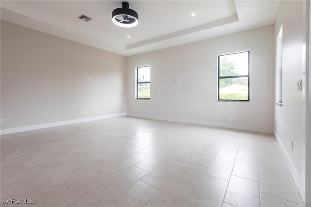 10295 Carolina St, Bonita Springs, FL 34135 - unfurnished room with a tray ceiling, ceiling fan, recessed lighting, and light tile patterned floors