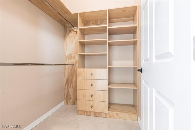 10295 Carolina St, Bonita Springs, FL 34135 - walk in closet featuring tile patterned floors