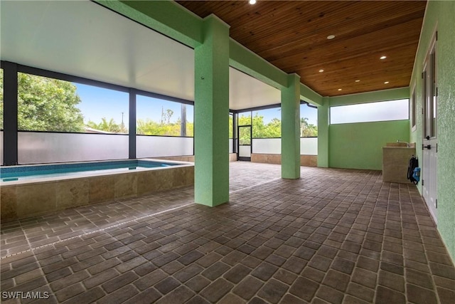 10295 Carolina St, Bonita Springs, FL 34135 - unfurnished sunroom featuring a pool