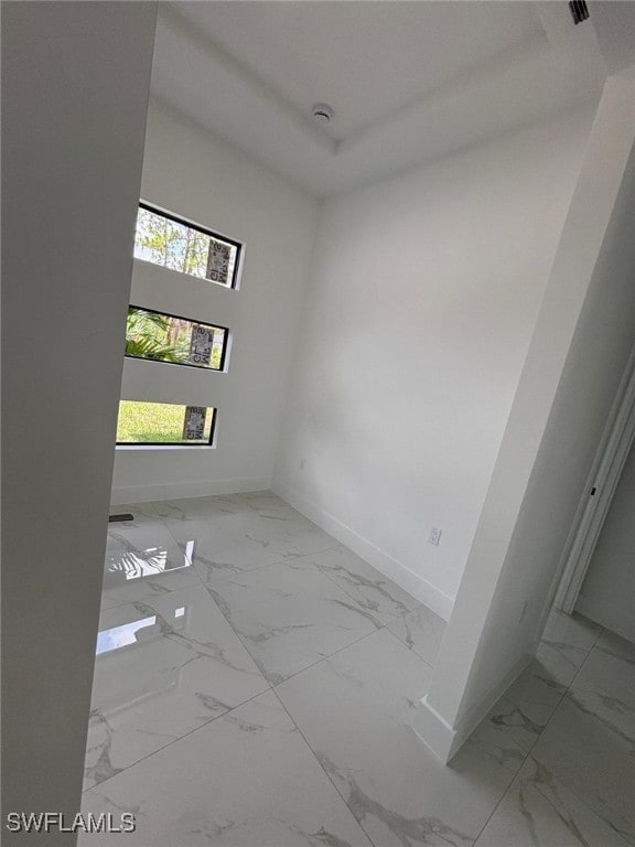 2909 Dora Ave N, Lehigh Acres, FL 33971 - empty room with marble look tiles