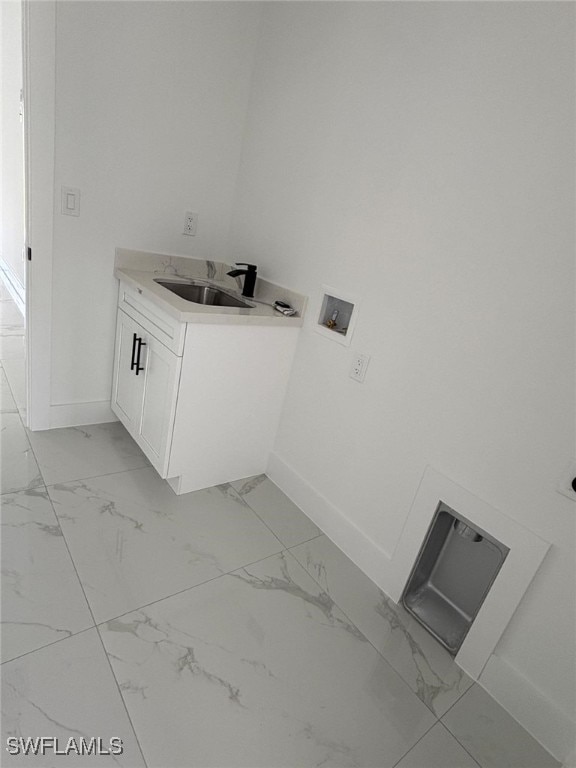 2909 Dora Ave N, Lehigh Acres, FL 33971 - washroom featuring light marble finish flooring, cabinet space, and hookup for a washing machine