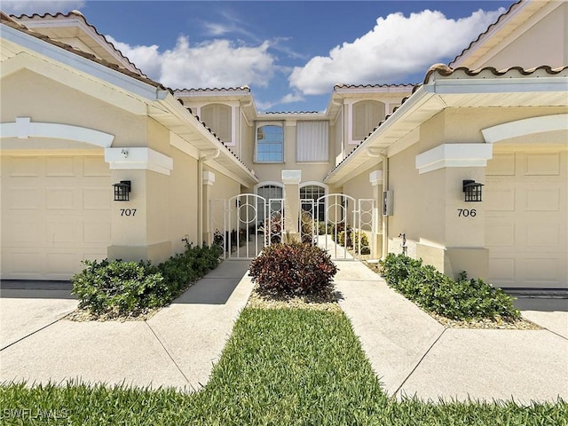 15054 Tamarind Cay Ct Unit 706, Fort Myers, FL 33908 - view of building exterior with an attached garage