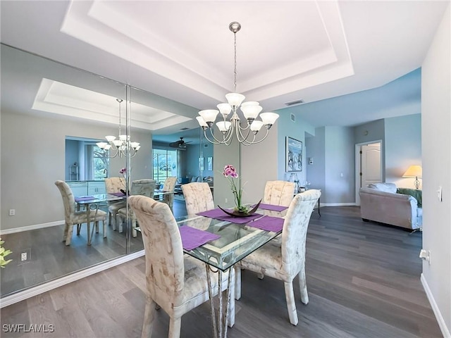 15054 Tamarind Cay Ct Unit 706, Fort Myers, FL 33908 - dining area with a raised ceiling, a chandelier, and wood finished floors